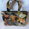 kindred-ltb-classic-b-back Back of the Kindred LTB Classic B, covered edge to edge in the glossy leaf print in orange, yellow and grey.