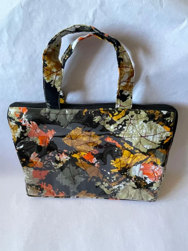 kindred-ltb-classic-b-back Back of the Kindred LTB Classic B, covered edge to edge in the glossy leaf print in orange, yellow and grey.